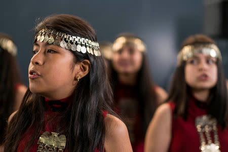 Mapuche indigenous community members attend an official ceremony along with Chile's President Sebastian Pinera (not pictured) in Temuco, Chile, September 24, 2018. Sebastian Rodriguez/Courtesy of Chilean Presidency/Handout via REUTERS