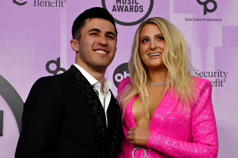 Meghan Trainor (R) and Chris Olsen attend the American Music Awards in 2022. File Photo by Jim Ruymen/UPI