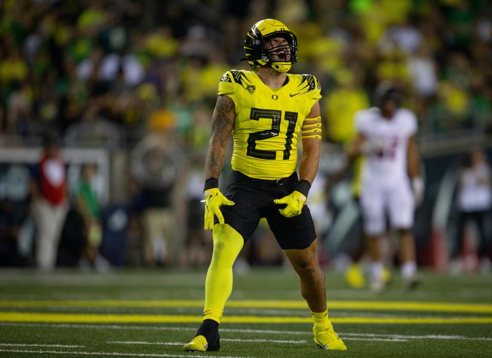 Oregon inside linebacker Keith Brown celebrates after taking down Eastern Washington’s quarterback during the second half in September 2022 at Autzen Stadium.