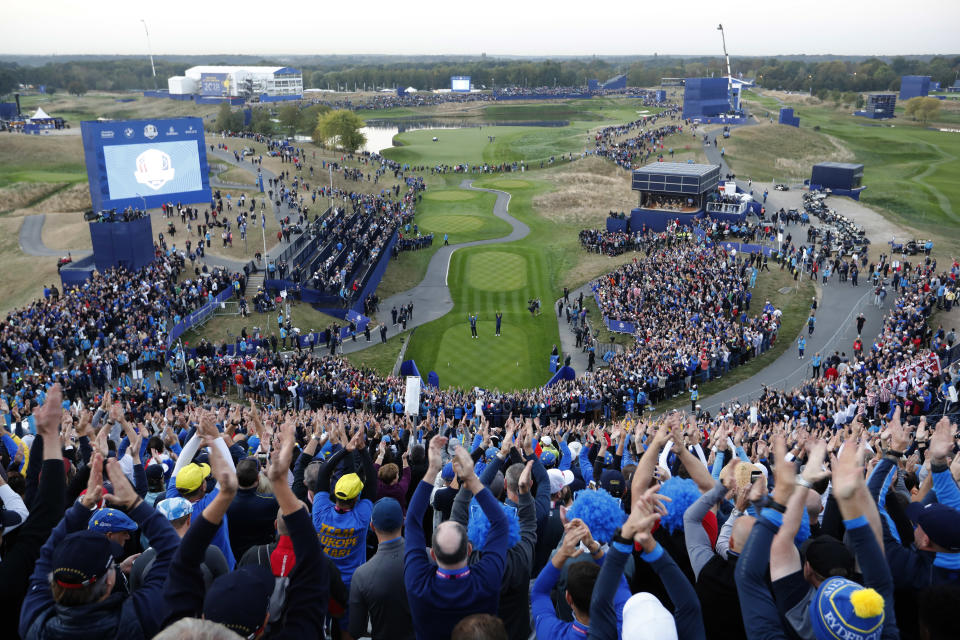 General view of the 1st hole as fans clap their hands on the opening day of the 2018 Ryder Cup at Le Golf National in Saint-Quentin-en-Yvelines, outside Paris, France, Friday, Sept. 28, 2018. (AP Photo/Laurent Cipriani)