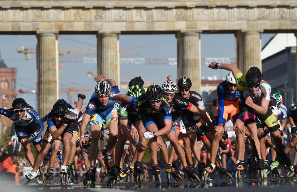 In-line skaters sprint towards the finish line during the in-line skating competition at the 2016 Berlin Marathon.