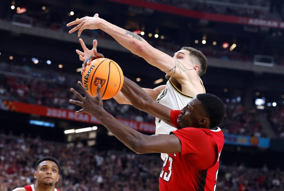 N.C. State’s Mohamed Diarra (23) pulls in the ball from Purdue’s Mason Gillis (0) during the first half of N.C. State’s game against Purdue in the NCAA Tournament national semfinals at State Farm Stadium in Glendale, Ariz., Saturday, April 6, 2024. Ethan Hyman/ehyman@newsobserver.com