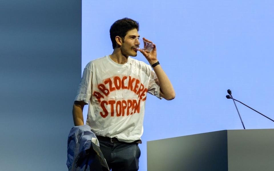 A shareholder wears a t-shirt reading "Stop the Rip Off" at the Credit Suisse AGM - Stefan Wermuth/Bloomberg
