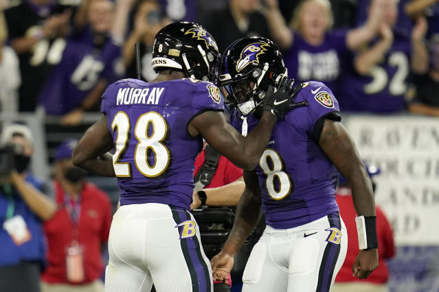 Quarterback Lamar Jackson of the Baltimore Ravens celebrates his