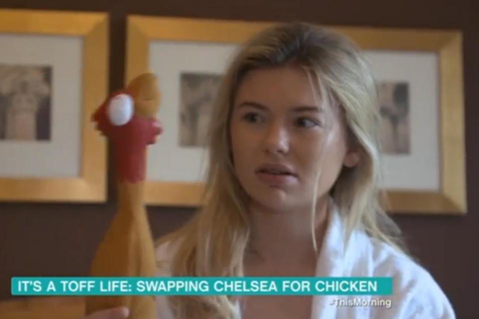 Big day: Georgia Toffolo didn't look impressed when she discovered she'd be working at KFC (ITV)