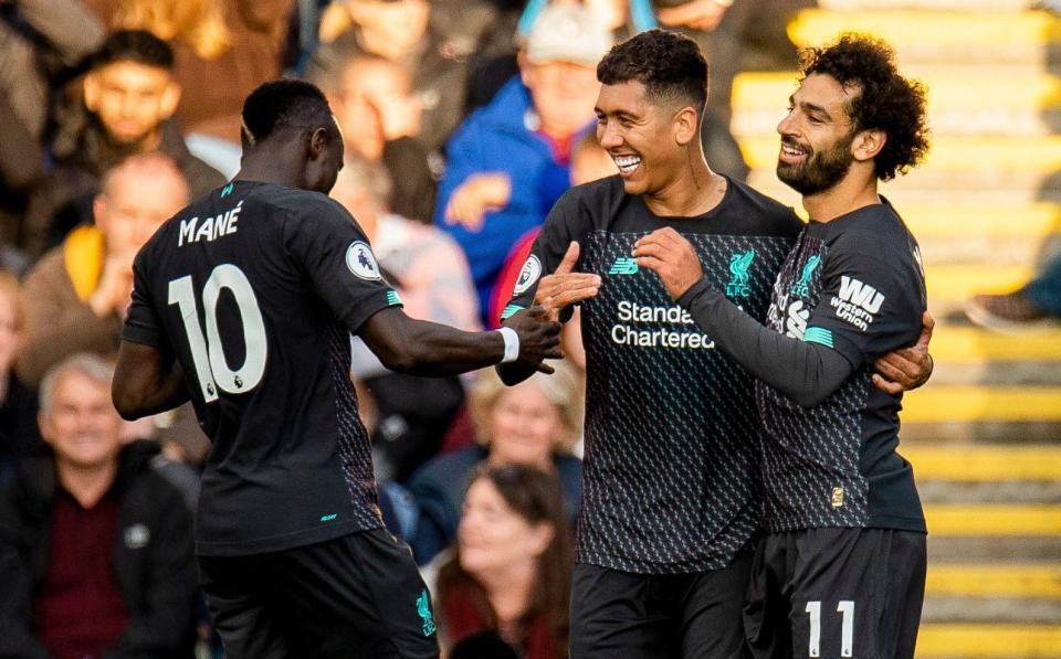 Liverpool's Roberto Firmino celebrates scoring the third goal with Mohamed Salah (R) and Sadio Mane (L) - PETER POWELL/EPA-EFE/REX