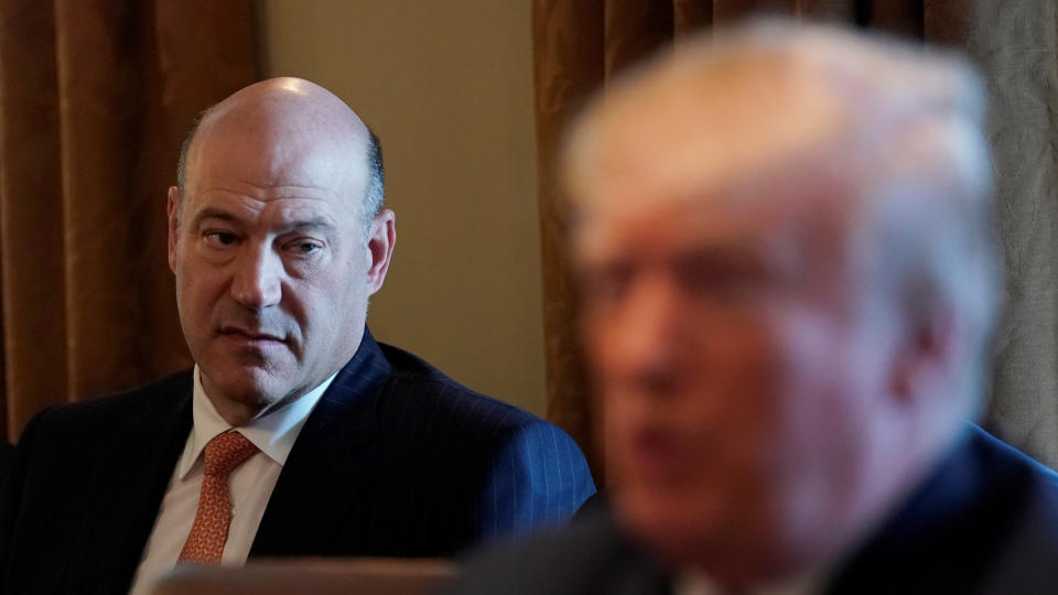 Outgoing economic adviser Gary Cohn (L) listens as U.S. President Donald Trump speaks during a cabinet meeting at the White House in Washington, U.S., March 8, 2018. REUTERS/Kevin Lamarque