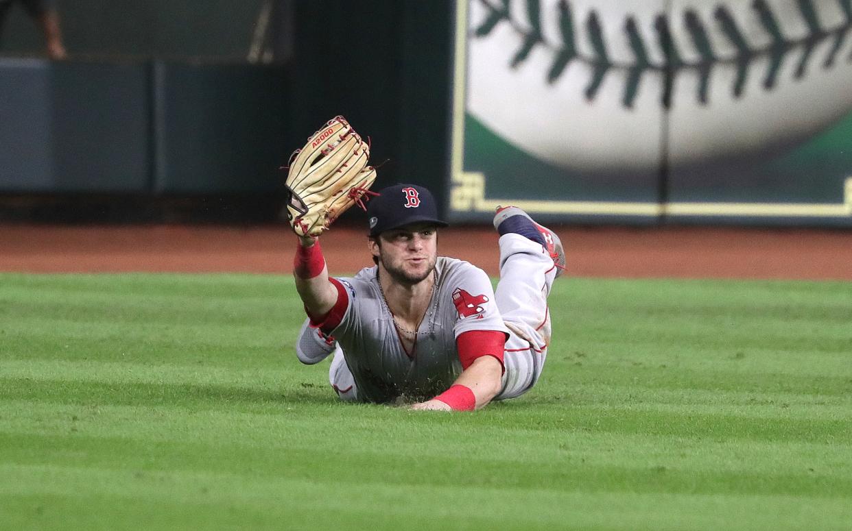 Andrew Benintendi’s amazing catch ended a wild ALCS Game 4. (Getty Images)