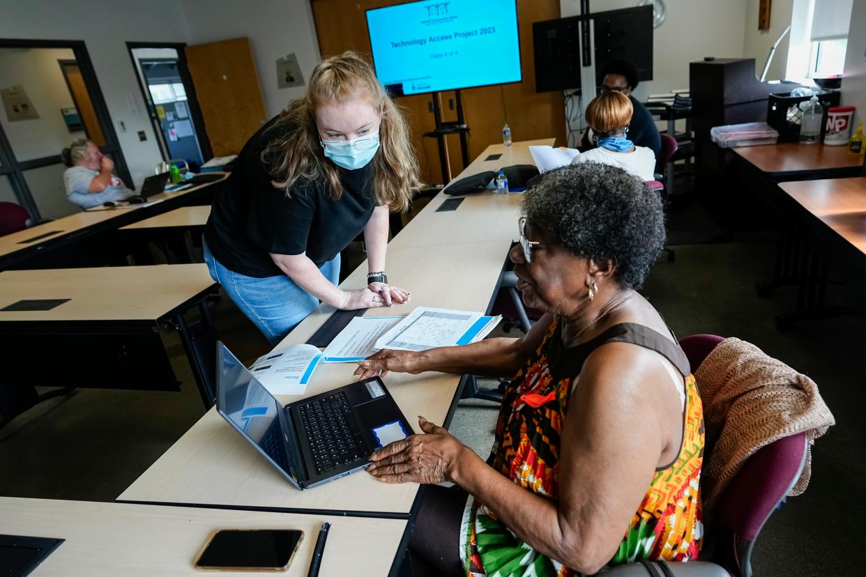 Bonita Leslie-Pegram, 72, receives login assistance from Kara Shamblin during the Technology Access Project class for seniors at the Central Community House on the Near East Side on June 30. The Central Community House, a local nonprofit, received funding from Spectrum and the Franklin County Office on Aging to offer the class, which provides students with a Google Chromebook as well as training.