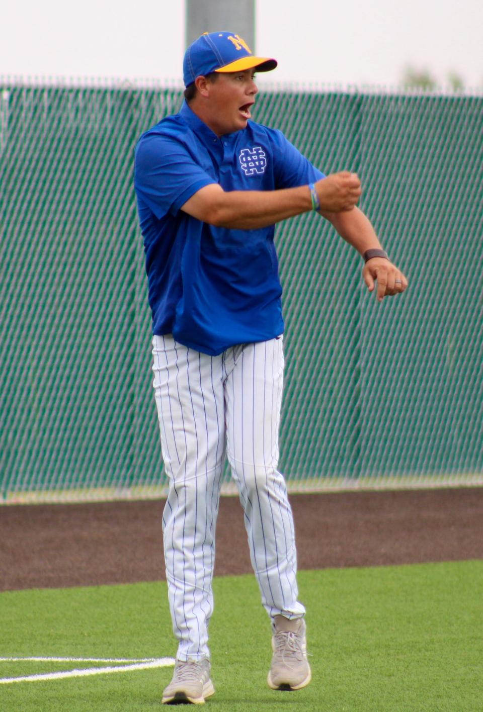 Nazareth head coach Tyler Goodwin directs traffic at third base during a Region I-1A quarterfinal baseball playoff series at Littlefield on Thursday, May 12, 2022.