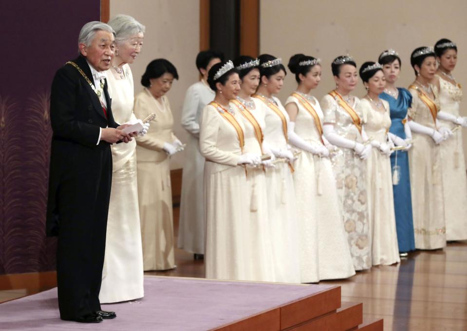 Japanese Emperor Akihito, left, accompanied by Empress Michiko, second from left, delivers a speech during an imperial ceremony in the celebration of New Year at the Imperial Palace in Tokyo, Tuesday. Jan. 1, 2019. (Kyodo News via AP)
