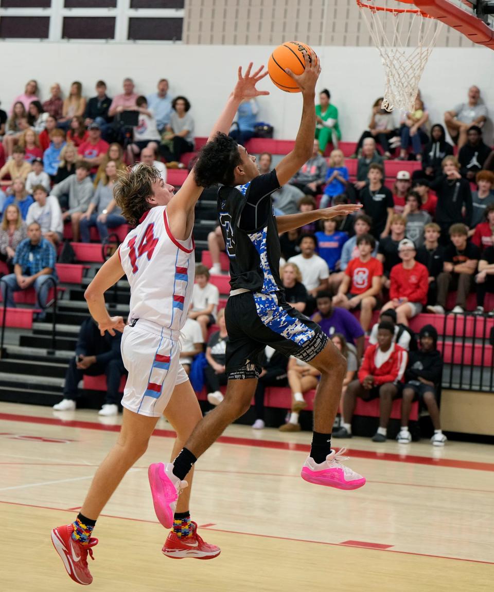 Matanzas' Tariq Shakir (3) gets fouled while attempting to drive to the basket against Seabreeze at Seabreeze High School, Friday, Dec. 1, 2023.