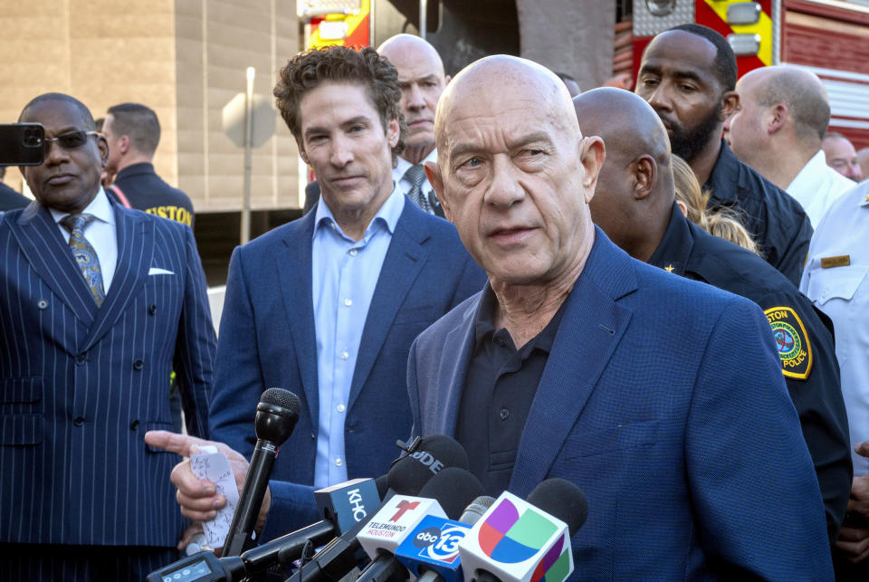 Lakewood Church pastor Joel Osteen, left center, listens as Mayor John Whitmire comments during a press conference during an active shooter event at Lakewood Church Sunday, Feb. 11, 2024. (Kirk Sides/Houston Chronicle via AP)