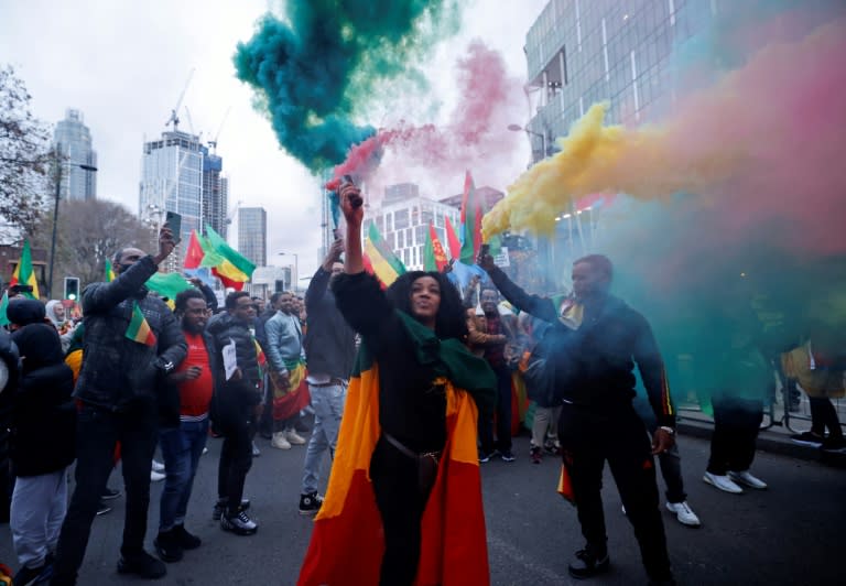 Demonstrators hold Ethiopian flags as they protest outside the US embassy in London on November 21, 2021 (AFP/Tolga Akmen)