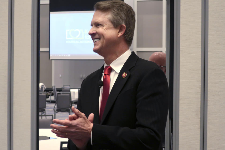 FILE - U.S. Rep. Roger Marshall, R-Kan., a candidate for the U.S. Senate, awaits the start of a debate in Olathe, Kan. in a Feb. 1, 2020 file photo. His opponent Kris Kobach, in the final days of a heated campaign is accusing Marshall, a physician, of performing an abortion. Rep. Marshall's campaign says the procedure was to end a life-threatening ectopic pregnancy and does not constitute an abortion. (AP Photo/John Hanna, File)