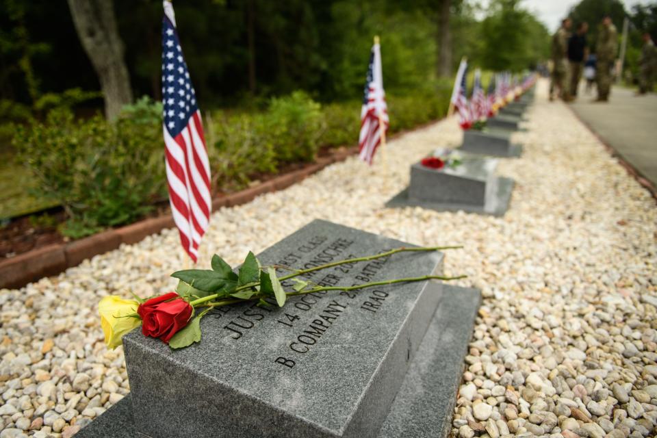 Roses sit on the memorial stone for Sgt. 1st Class Justin Monschke during 3rd Special Forces Group's memorial ceremony, which honors the group's soldiers killed in action.