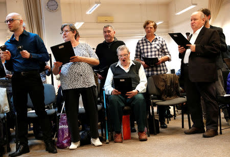 Members of the "Breathing for the Soul" choir, who are patients suffering from lung diseases, sing during a rehearsal in Budapestt, Hungary, November 15, 2018. Picture taken November 15, 2018. REUTERS/Bernadett Szabo