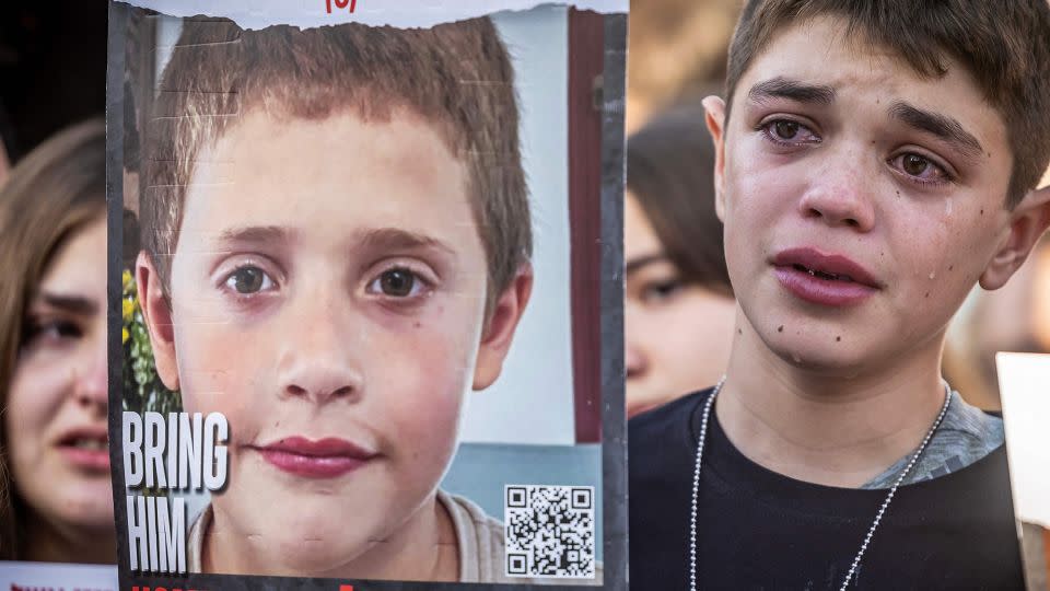 Friends and relatives of Israeli hostages abducted by Palestinian militants on October 7 and currently held in the Gaza Strip hold placards bearing their portraits as they demonstrate outside Israel's parliament demanding government action for their return, in Jerusalem on November 6. - Fadel Senna/AFP/Getty Images