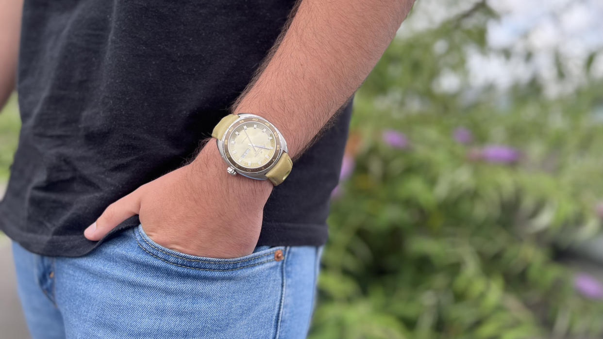  The Hamilton Pan Europ in Green worn against a background of flowers 