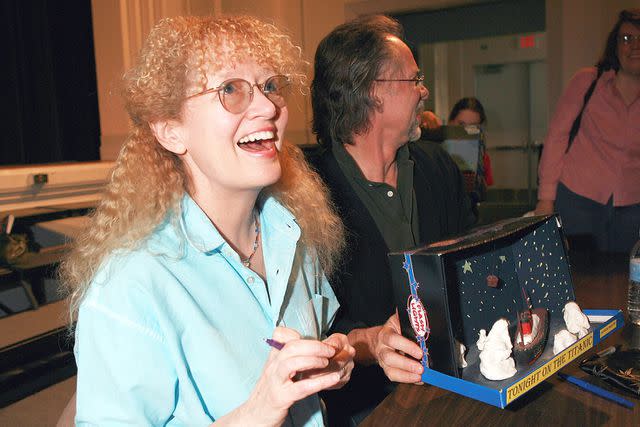 <p>Bob Berg/Getty</p> Mary Pope Osborne and her husband Will Osborne at a book signing in 2006