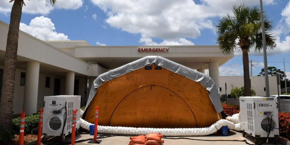 A treatment tent is seen outside the emergency department at Holmes Regional Medical Center in Melbourne