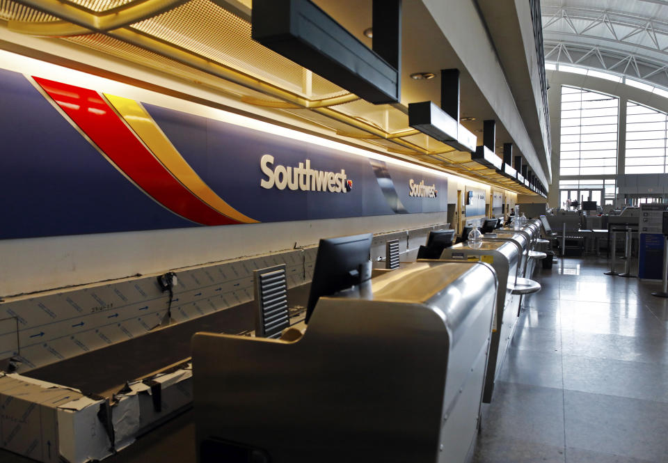 The Southwest Airlines counter at Midland International Air and Space Port sits empty on Friday, April 3, 2020, in Midland, Texas, after the outbreak of COVID-19 in the United States has caused a drastic decrease in air travel. (Eli Hartman/Odessa American via AP)