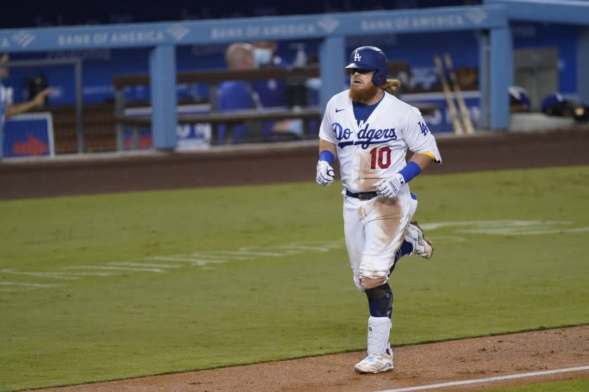 The Dodgers' Justin Turner rounds the bases after homering during the third inning Sept. 25, 2020.