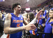 Florida guard Will Richard celebrates with fans after the second half of an NCAA college basketball game Wednesday, Feb. 1, 2023, in Gainesville, Fla. (AP Photo/Alan Youngblood)