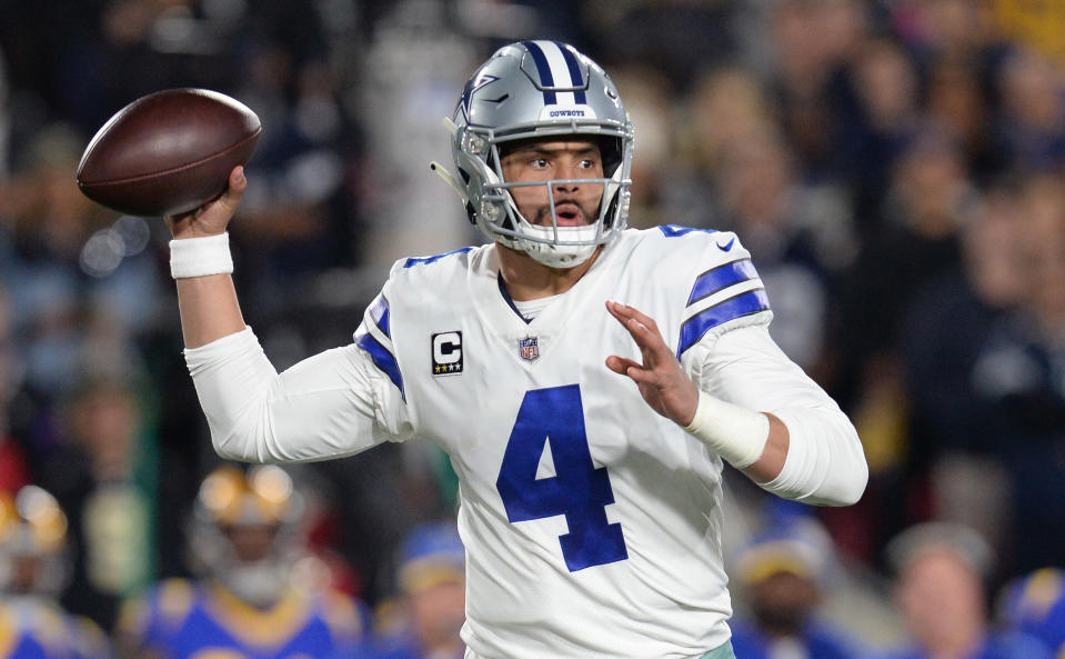 Jan 12, 2019; Los Angeles, CA, USA; Dallas Cowboys quarterback Dak Prescott (4) passes against the Los Angeles Rams in the first half in a NFC Divisional playoff football game at Los Angeles Memorial Stadium. Mandatory Credit: Gary A. Vasquez-USA TODAY Sports