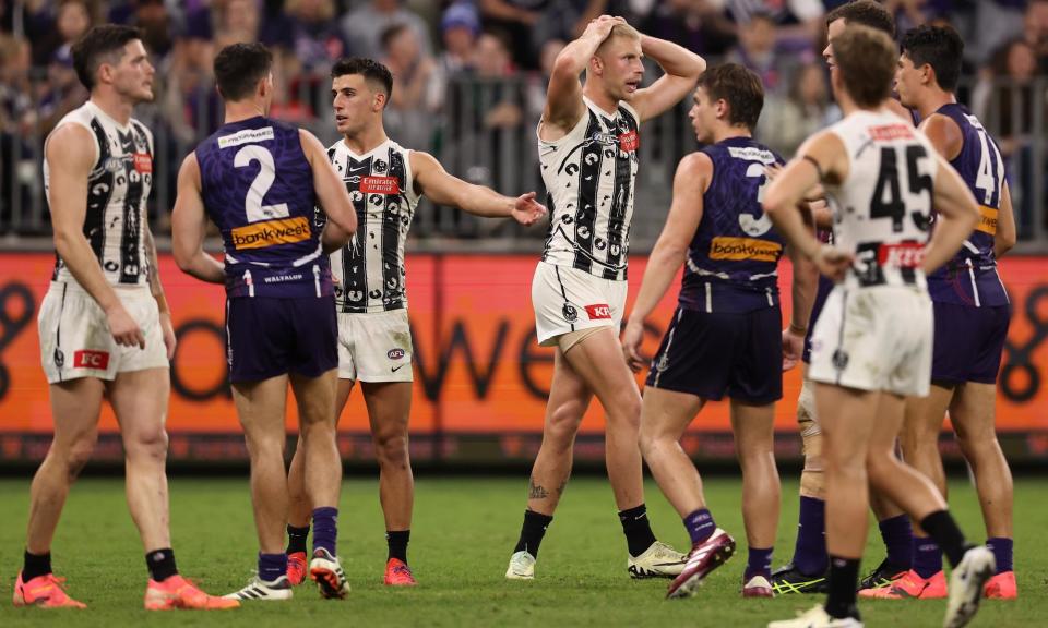 <span>Collingwood’s Billy Frampton reacts to the contentious free kick awarded to Docker Sean Darcy in their draw.<br></span><span>Photograph: Paul Kane/Getty Images</span>