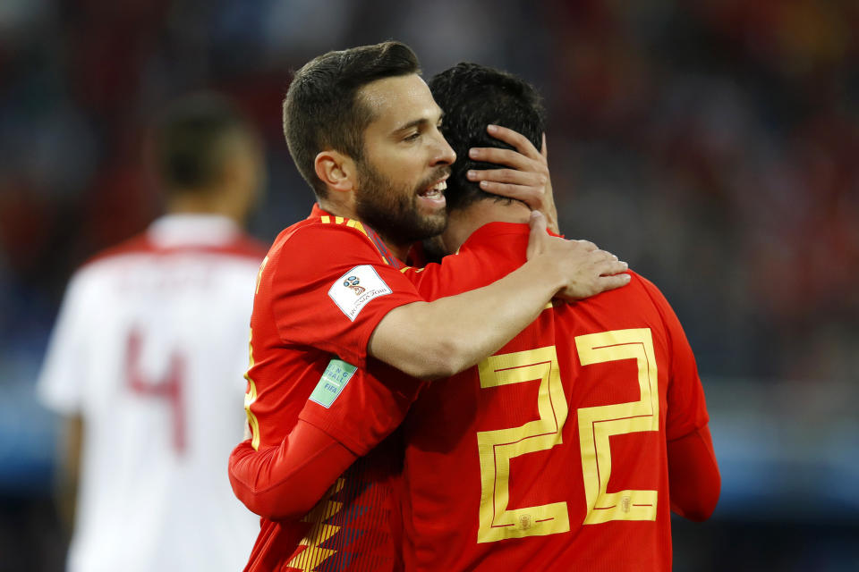 <p>Spain’s Isco gets a cuddle after his goal </p>