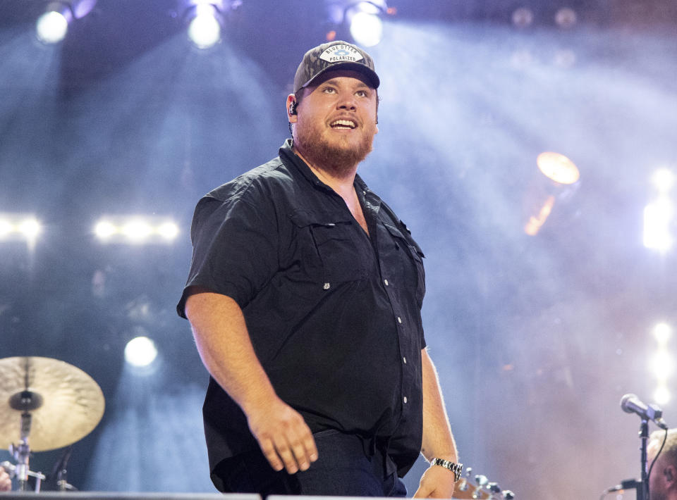 FILE - Luke Combs performs during CMA Fest 2022 in Nashville, Tenn., on June 11, 2022. Comb's latest album, "Growin' Up," releases Friday, July 1. (Photo by Amy Harris/Invision/AP, File)