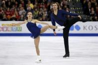 Meagan Duhamel and Eric Radford of Canada compete. REUTERS/Brian Snyder