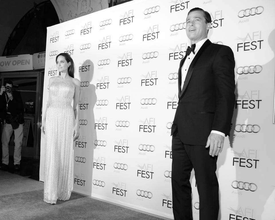 LOS ANGELES, CA - NOVEMBER 05:  (EDITORS NOTE: This image has been converted to black and white.)  Writer-director-producer-actress Angelina Jolie Pitt (L) and actor-producer Brad Pitt attend the opening night gala premiere of Universal Pictures' 'By the Sea' during AFI FEST 2015 presented by Audi at TCL Chinese 6 Theatres on November 5, 2015 in Hollywood, California.  (Photo by Michael Kovac/Getty Images for AFI)