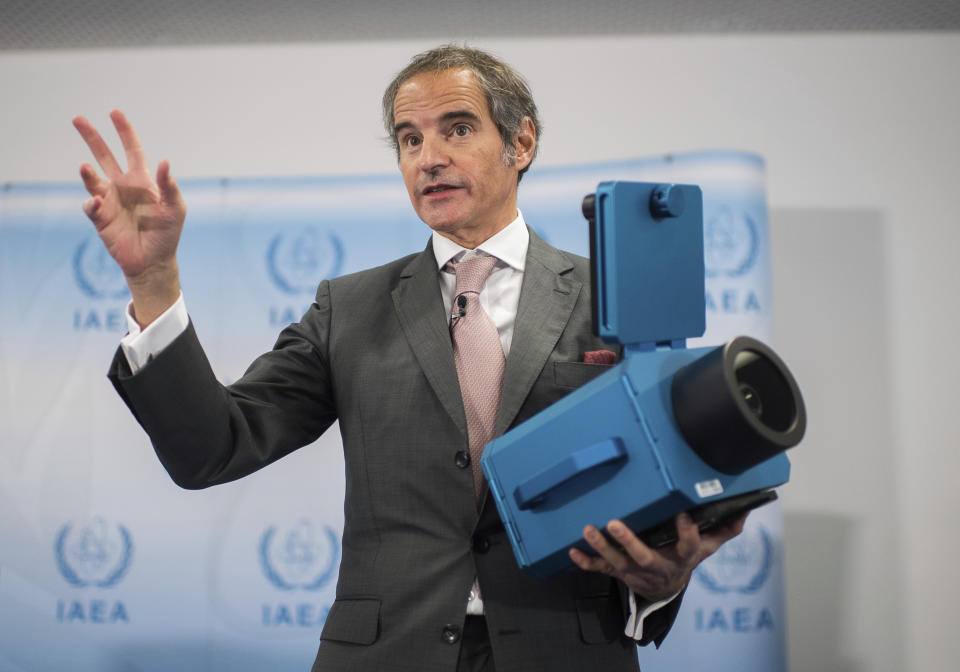Director General of the International Atomic Energy Agency, IAEA, Rafael Mariano Grossi shows an "IAEA Camera" during an press conference in Vienna, Austria, Friday, Dec. 17, 2021. (AP Photo/Michael Gruber)