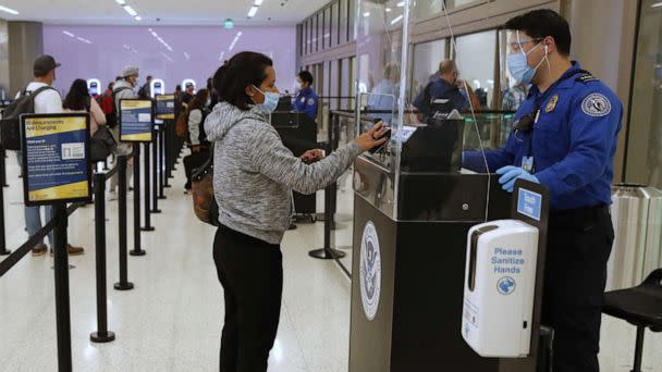 PHOTO: A TSA agent checks the identification of a travelers at the security screening center at Salt Lake City International Airport in Salt Lake City, Sept. 15, 2020. (Bloomberg via Getty Images, FILE)