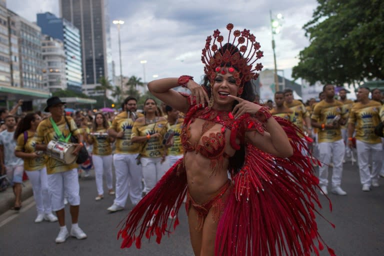 A samba school member dances at a Copacabana beach street party one month ahead of the main carnival parades in Rio de Janeiro