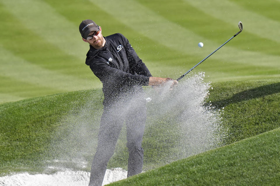 Patrick Rodgers blasts from a sand trap along the second green during a practice round of The Players Championship golf tournament Wednesday, March 13, 2024, in Ponte Vedra Beach, Fla. (AP Photo/Chris O'Meara)