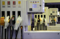 Closed pumps are seen on the forecourt of a petrol station which has run out of fuel after an outbreak of panic buying in the UK, in Manchester, England, Monday, Sept. 27, 2021. British Prime Minister Boris Johnson is said to be considering whether to call in the army to deliver fuel to petrol stations as pumps ran dry after days of panic buying. ( AP Photo/Jon Super)