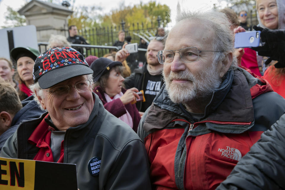 Ben Cohen, left, and Jerry Greenfield, co-founders of Ben and Jerry's ice cream, protest against climate policies and to impeach President Donald Trump outside an entrance to the White House, Friday, Nov. 8, 2019, in Washington. (AP Photo/Patrick Semansky)