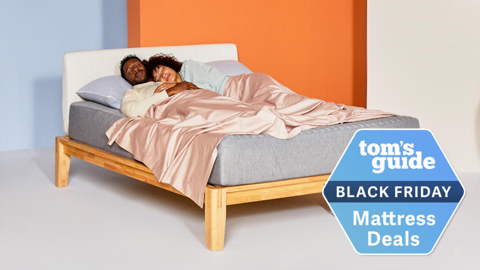  The Siena Memory Foam Mattress placed on a light wooden bedframe in an orange bedroom with a Black Friday mattress deals badge overlaid in blue. 