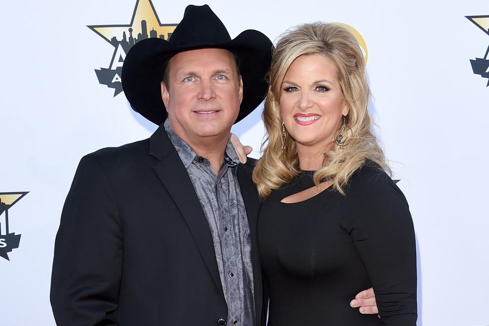 ARLINGTON, TX - APRIL 19: Honoree Garth Brooks (L) and singer Trisha Yearwood attend the 50th Academy of Country Music Awards at AT&amp;T Stadium on April 19, 2015 in Arlington, Texas. (Photo by Jason Merritt/Getty Images)