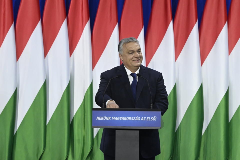 Hungary's Prime Minister Viktor Orban delivers his annual "State of Hungary" speech in Budapest, Hungary, Saturday, Feb. 17, 2024. The message on lectern reads: "For us Hungary is the first!" (Szilard Koszticsak/MTI via AP)