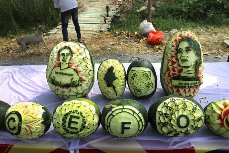 Carved watermelons showing the portrait of Aung San Suu Kyi are seen in Mandalay