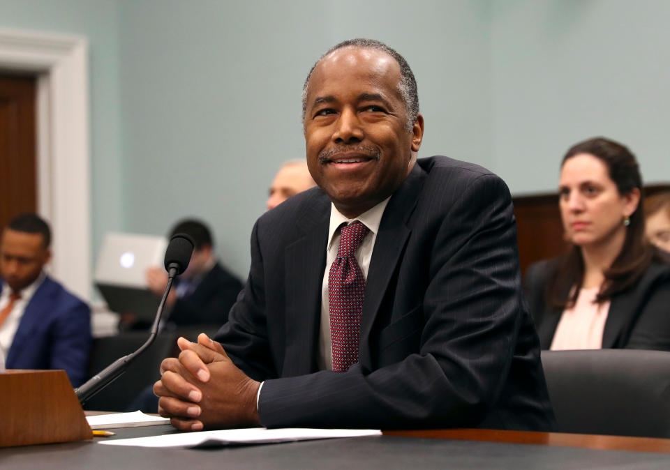 FILE - In this March 20, 2018, file photo, Housing and Urban Development Secretary Ben Carson takes his seat before testifying before a House Committee on Appropriation subcommittee hearing on Capitol Hill in Washington. Millions of families living in federally subsidized public housing would have to pay more for rent under a Trump administration proposal. The Department of Housing and Urban Development is asking Congress to raise the rent paid by public housing residents to 35 percent of income from the current 30 percent. (AP Photo/Pablo Martinez Monsivais, File)
