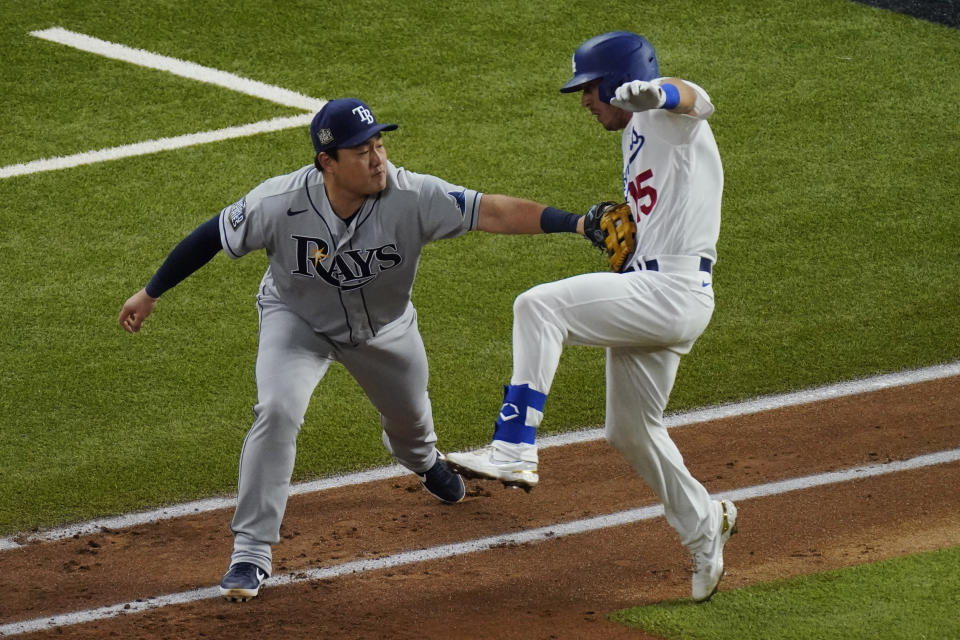 Tampa Bay Rays first baseman Ji-Man Choi tags out Los Angeles Dodgers' Austin Barnes during the third inning in Game 6 of the baseball World Series Tuesday, Oct. 27, 2020, in Arlington, Texas. (AP Photo/Sue Ogrocki)