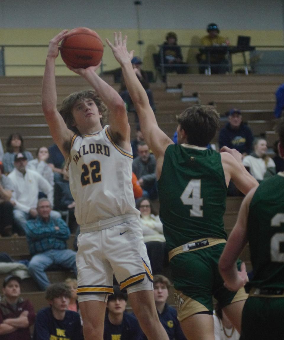 Luke Gelow shoots from mid-range during a basketball matchup between Gaylord and Traverse City West on Friday, February 10 in Gaylord, Mich.