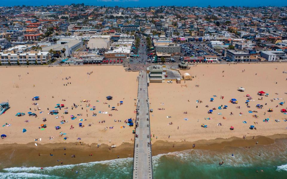 Los Angeles County beaches are reopened after they were re-closed over the Fourth of July