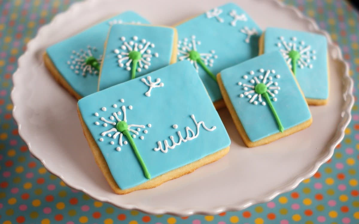 <p>Bridget Edwards</p><p>Fun to make as they are incredibly tasty to eat, these cookies are topped with blue fondant and adorned with a pretty dandelion. </p><p><strong>Get the recipe: <a href="https://parade.com/6888/bridgetedwards/a-touch-of-spring-delightful-dandelion-cookies/" rel="nofollow noopener" target="_blank" data-ylk="slk:Dandelion Cookies;elm:context_link;itc:0;sec:content-canvas" class="link rapid-noclick-resp">Dandelion Cookies</a></strong></p>