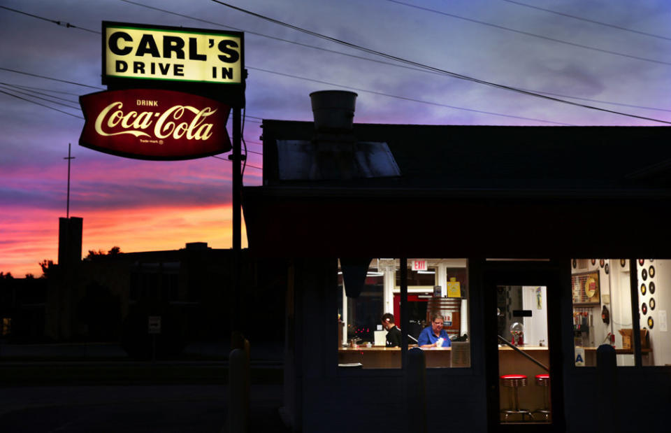 Jason Apple and Pam Martin clean up after closing for the day at Carl's Drive-In in Brentwood, Missouri, on Aug. 18, 2016. The mainstay along old Route 66, built as a 1920s gas station, was renamed in 1959 by owner Carl Meyer.&nbsp;<i></i> (Photo: Photo by Robert Cohen/St. Louis Post-Dispatch)